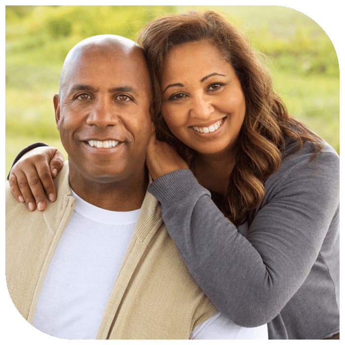 local-matchmaking-michigan-office smiling african american couple hugging