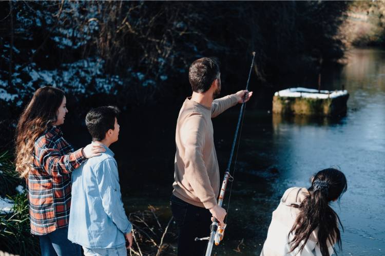 family-looking-over-water (2)