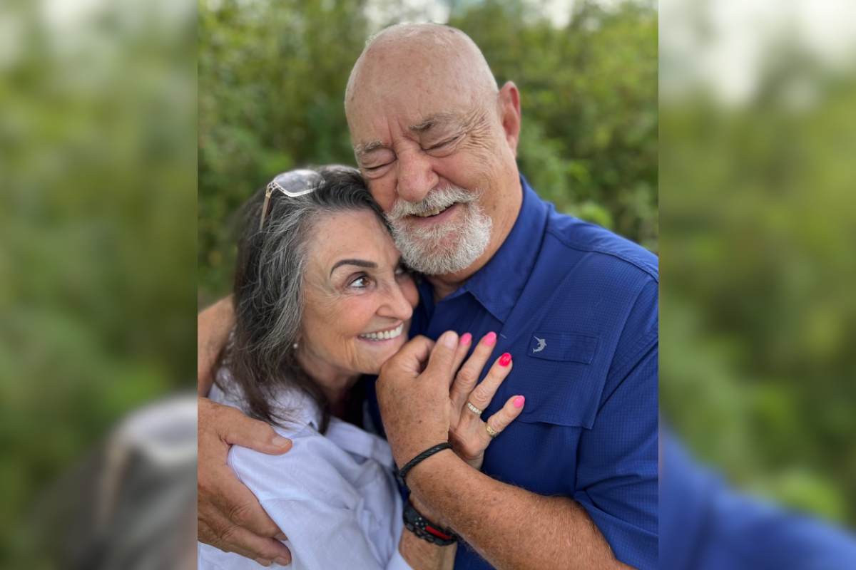 Jerry and Jerri embracing one another and smiling