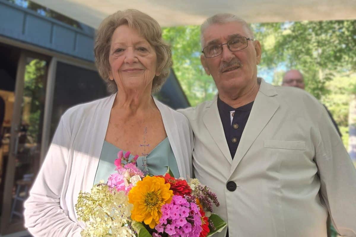 Wayne and Sharon smiling on their wedding day.