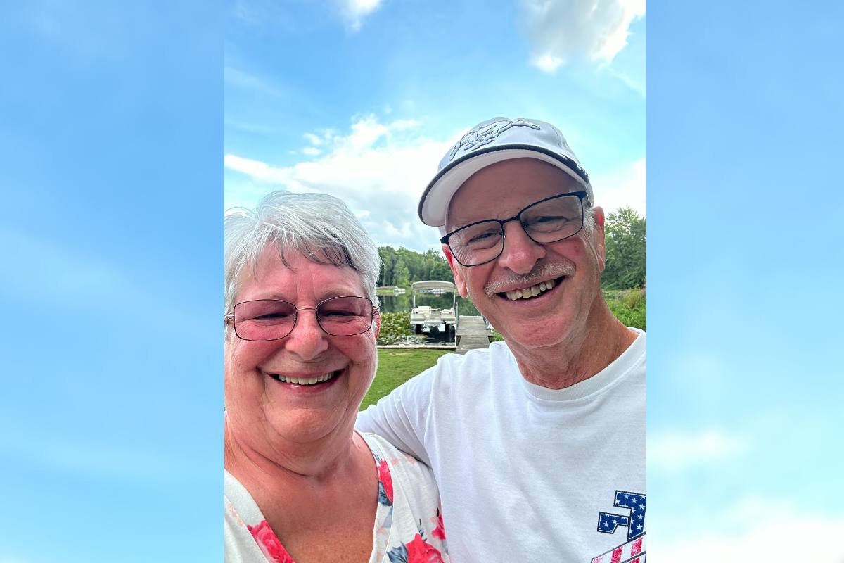 David and Becky smiling together on a sunny day.