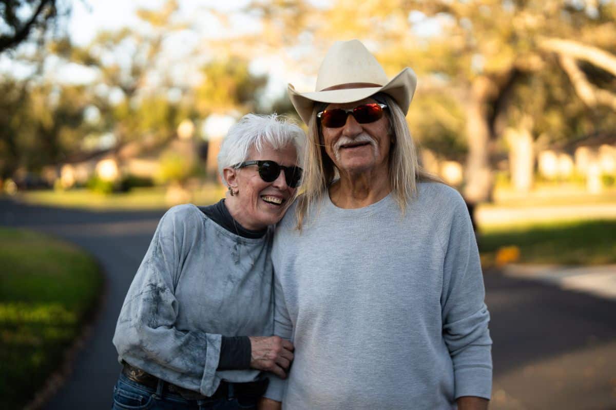 Jack and Deb smiling warmly on an afternoon walk.