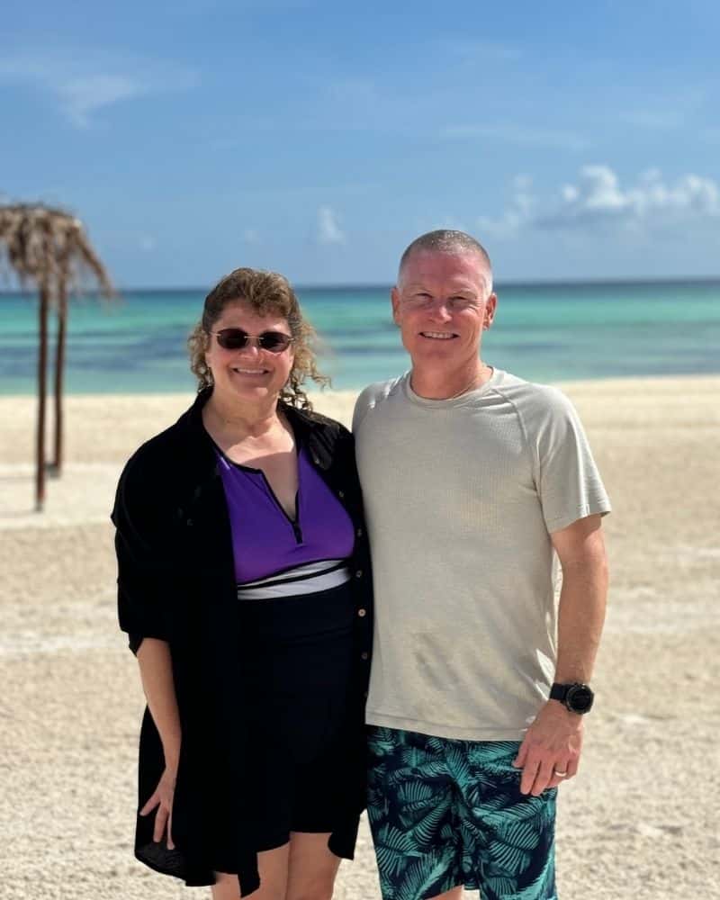 Matchmaking success couple smiling on white sand beach