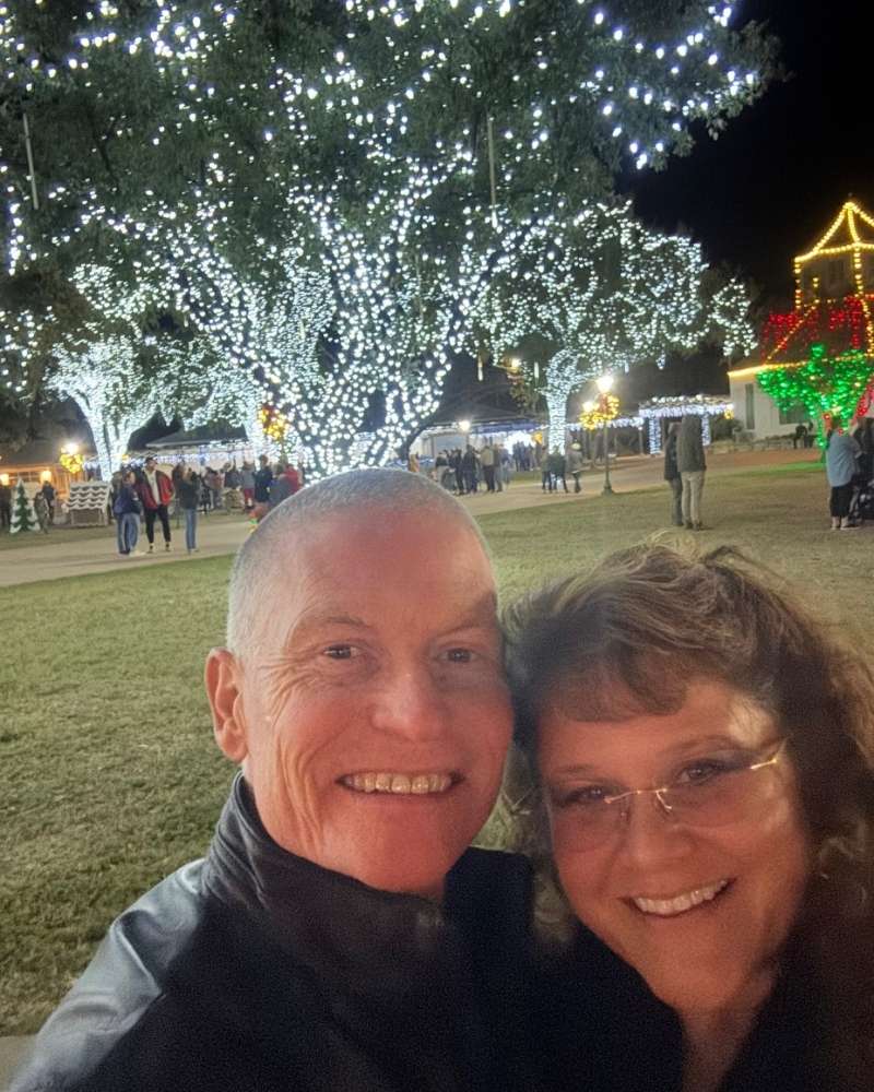 Matchmaking success couple smiling for selfie at holiday event