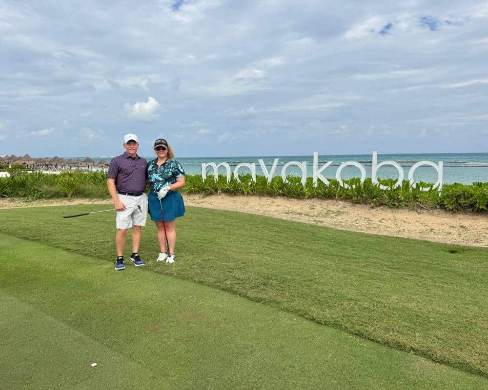 Matchmaking success couple standing together on golf course