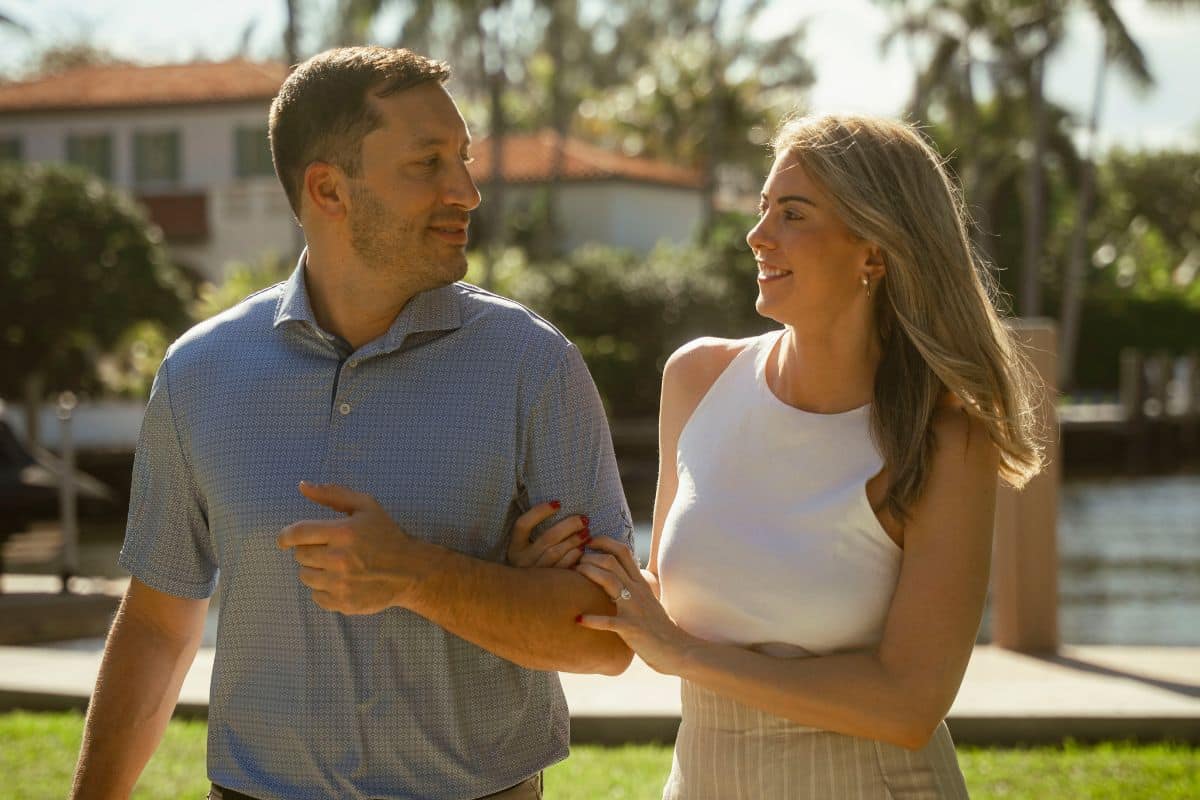 Real TMC Couple Frank and Niki smiling together on a walk.
