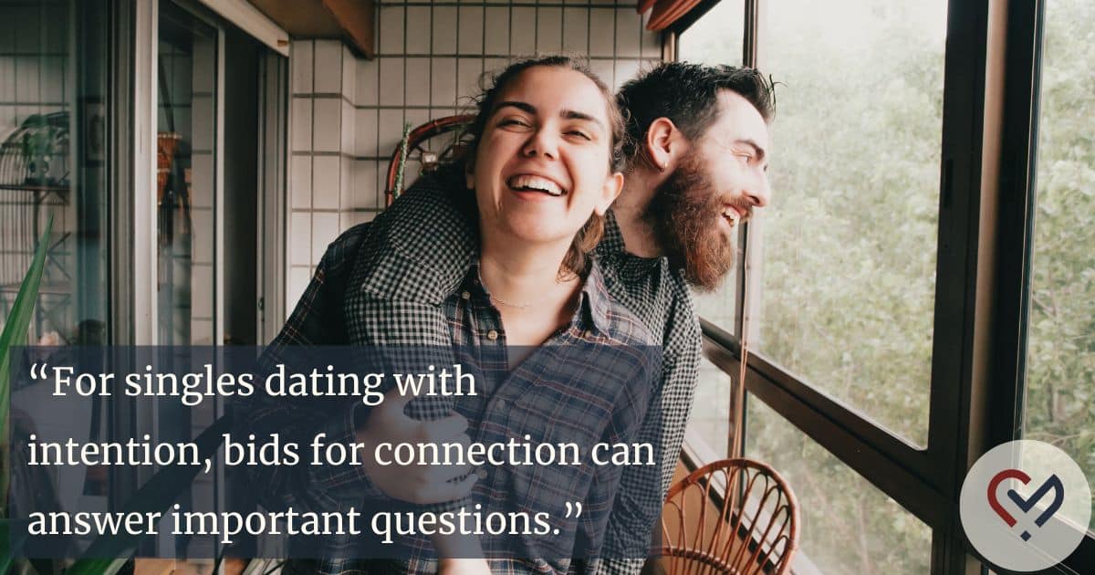 Affectionate couple leaning onto each other while laughing, reflecting strong emotional connection in a healthy relationship