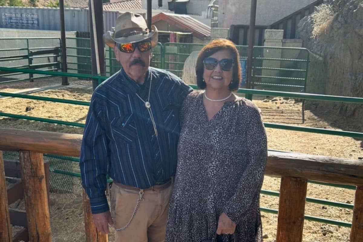 Harold and Grace posing together in western wear.